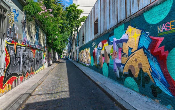 Graffiti-covered street in Buenos Aires during a city tour.