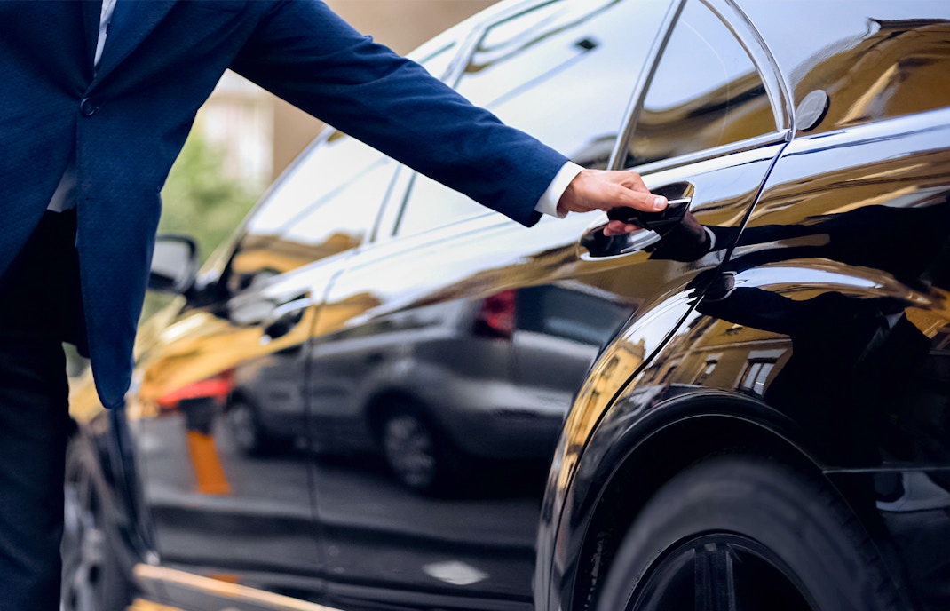 man getting in private car