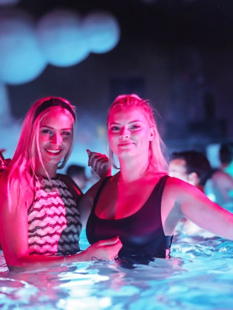 People enjoying a vibrant bath party in Budapest.