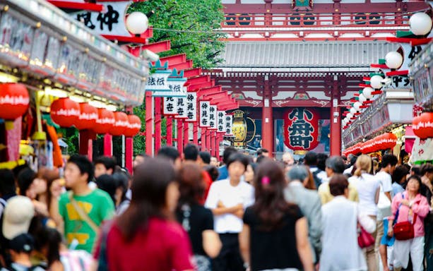 Crowds walking along Nakamise-dori towards Sensō-ji Temple in Asakusa, Tokyo, Japan.