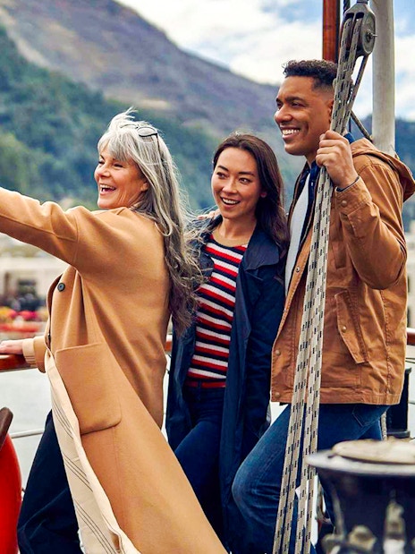 Group enjoying TSS Earnslaw Lake Cruise from Queenstown with scenic mountain views.
