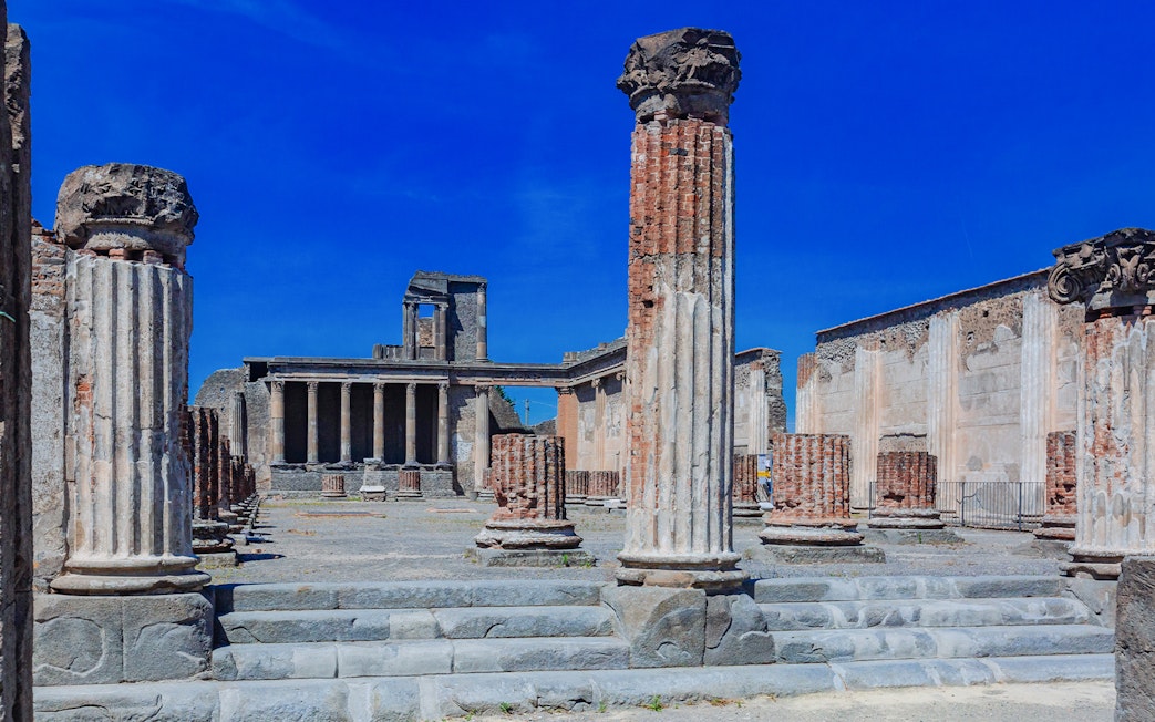 Ancient columns and ruins of The Basilica in Pompeii, Italy.