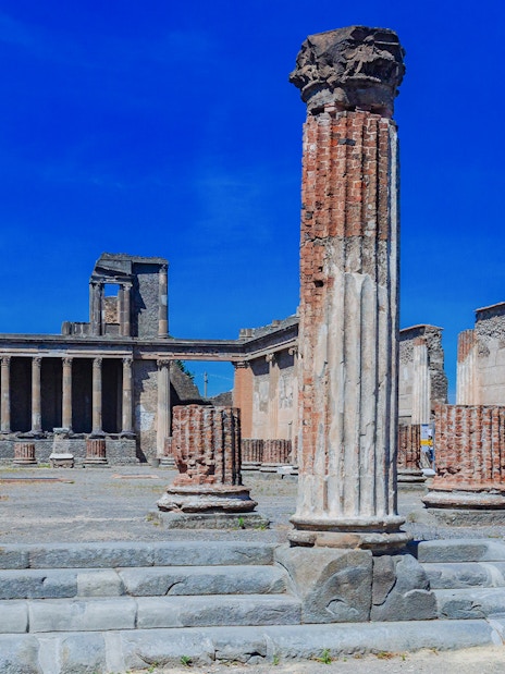 Ancient columns and ruins of The Basilica in Pompeii, Italy.