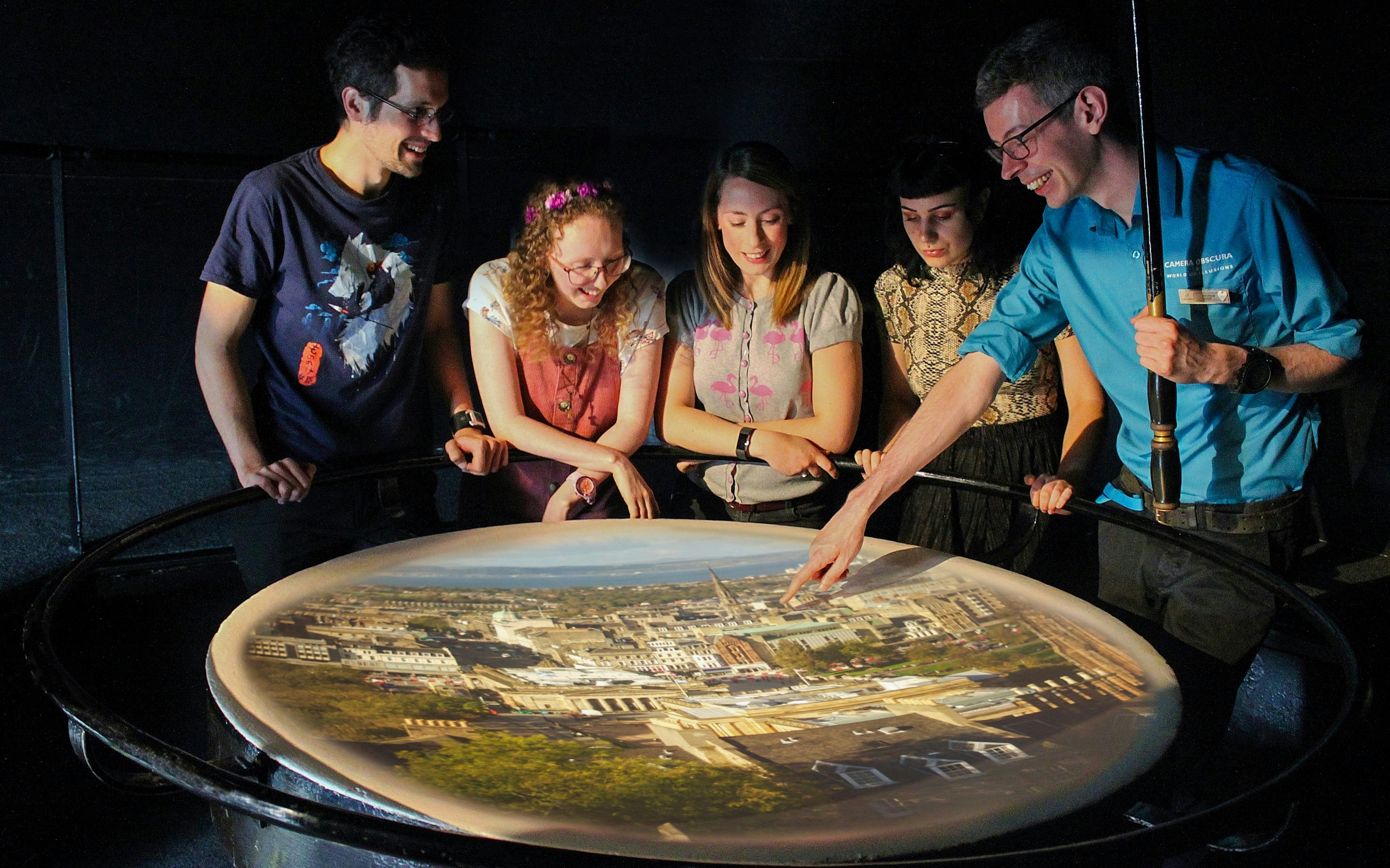 Visitors engaging with a city projection at Camera Obscura & World of Illusions, Edinburgh.