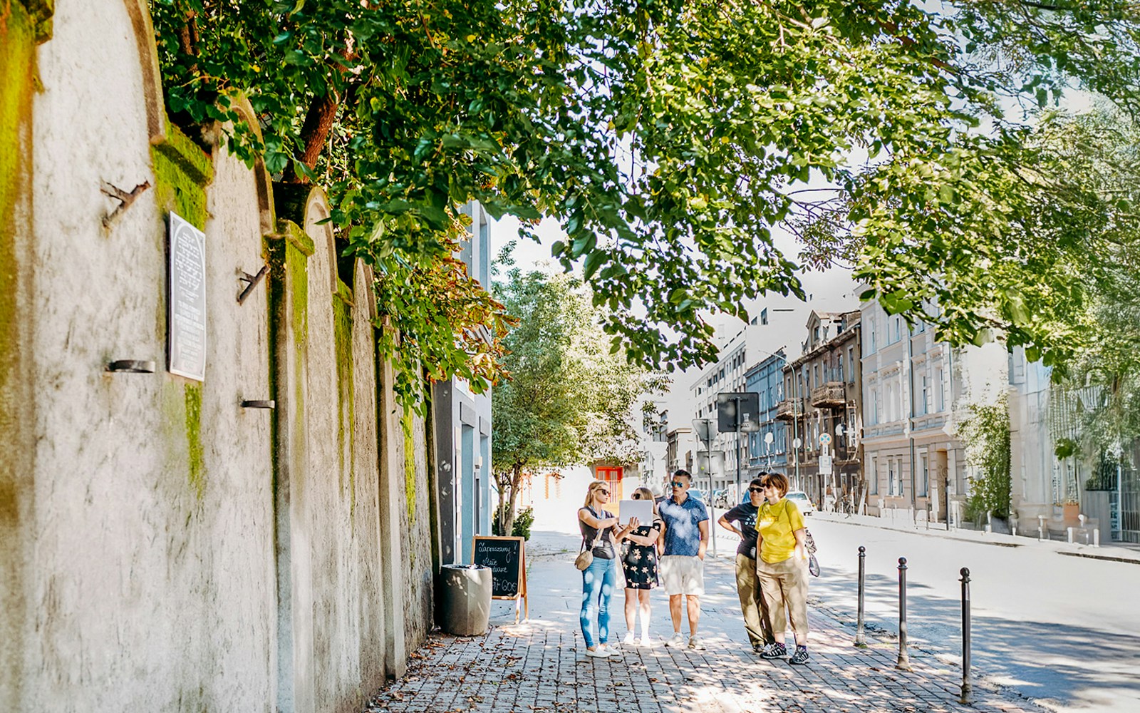 Tour group exploring Oskar Schindler’s Factory area in Krakow.