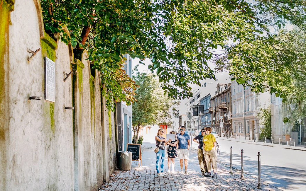 Tour group exploring Oskar Schindler’s Factory area in Krakow.