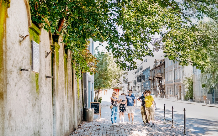 Tour group exploring Oskar Schindler’s Factory area in Krakow.