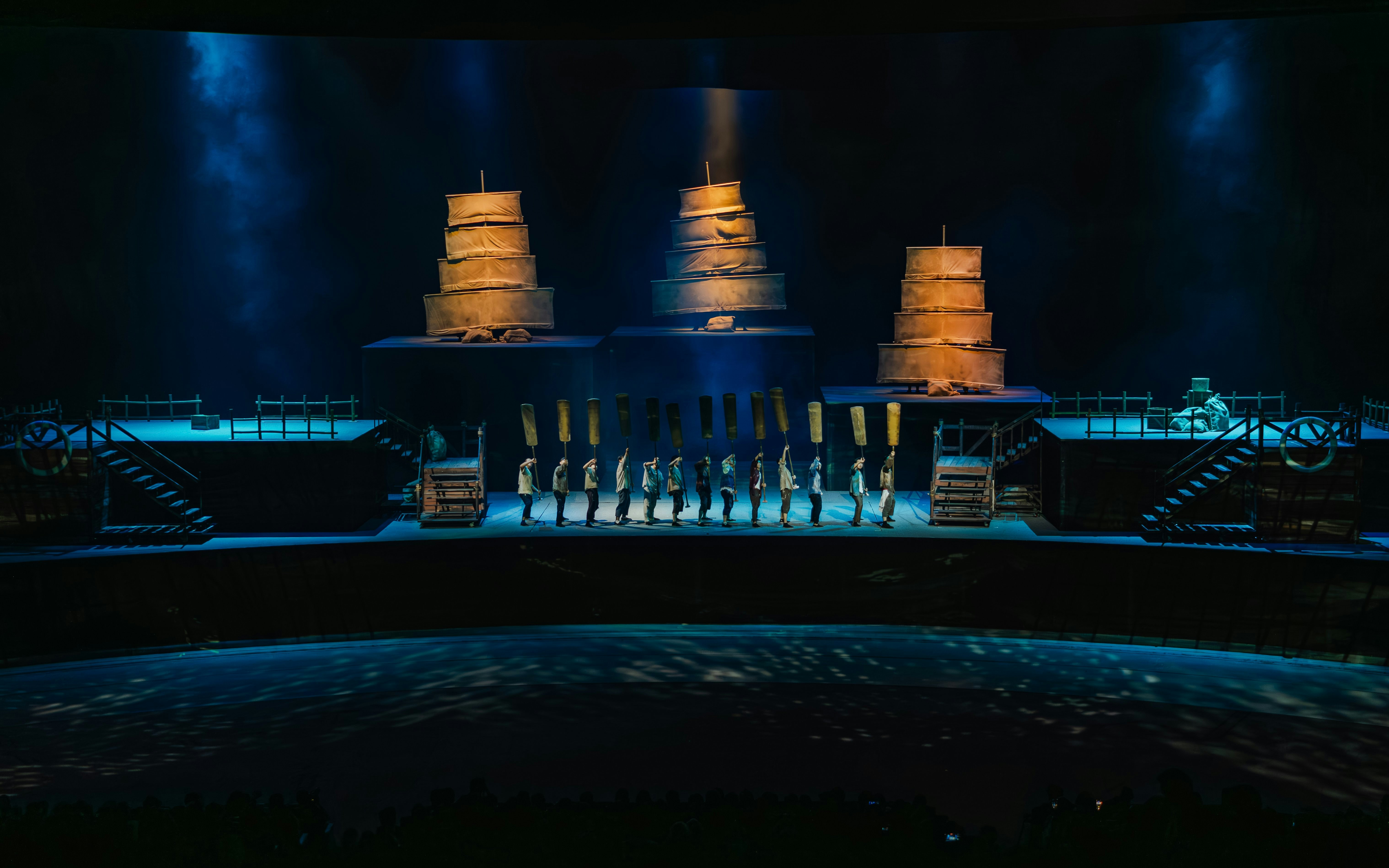 Performers on stage with ship sails at The Legacy of a Generation Show.