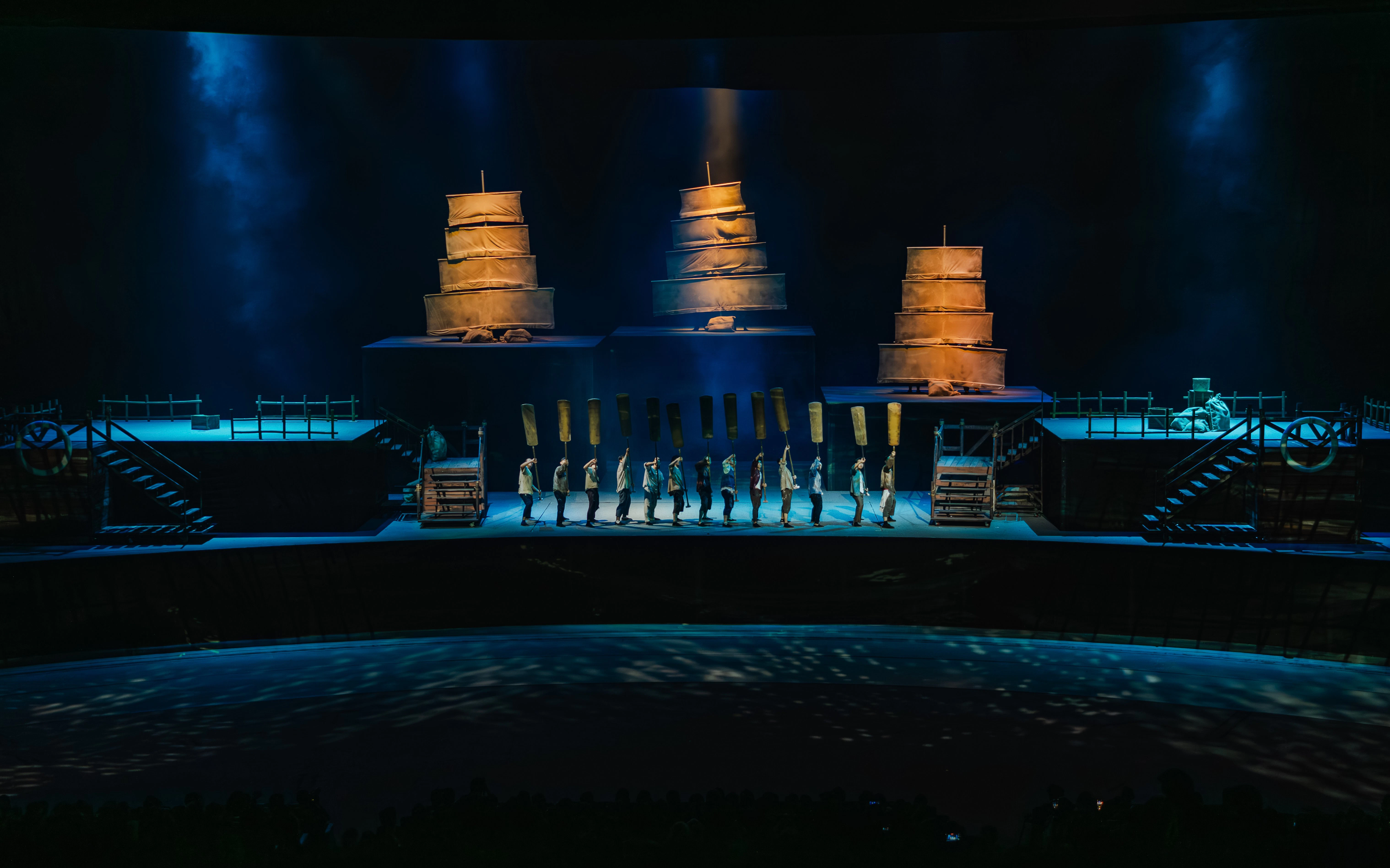 Performers on stage with ship sails at The Legacy of a Generation Show.