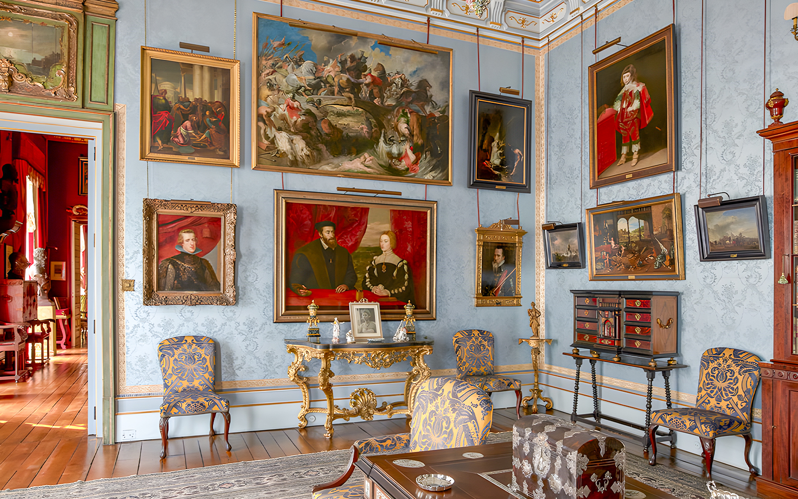 Art-filled room in Liria Palace with ornate furniture and historical paintings.