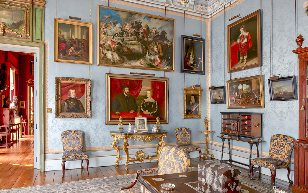 Art-filled room in Liria Palace with ornate furniture and historical paintings.