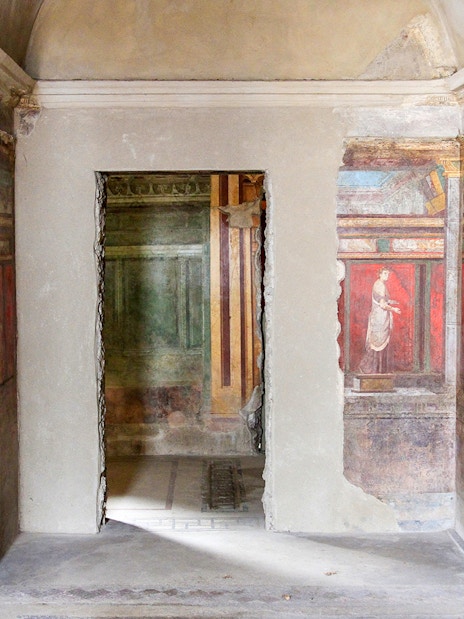 Frescoes in the Villa of the Mysteries, Pompeii, depicting ancient Roman figures.