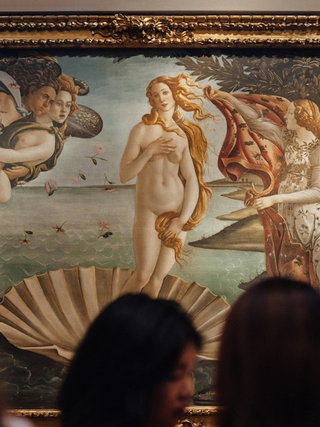 Tourists viewing "The Birth of Venus" by Botticelli at Uffizi Gallery, Florence.