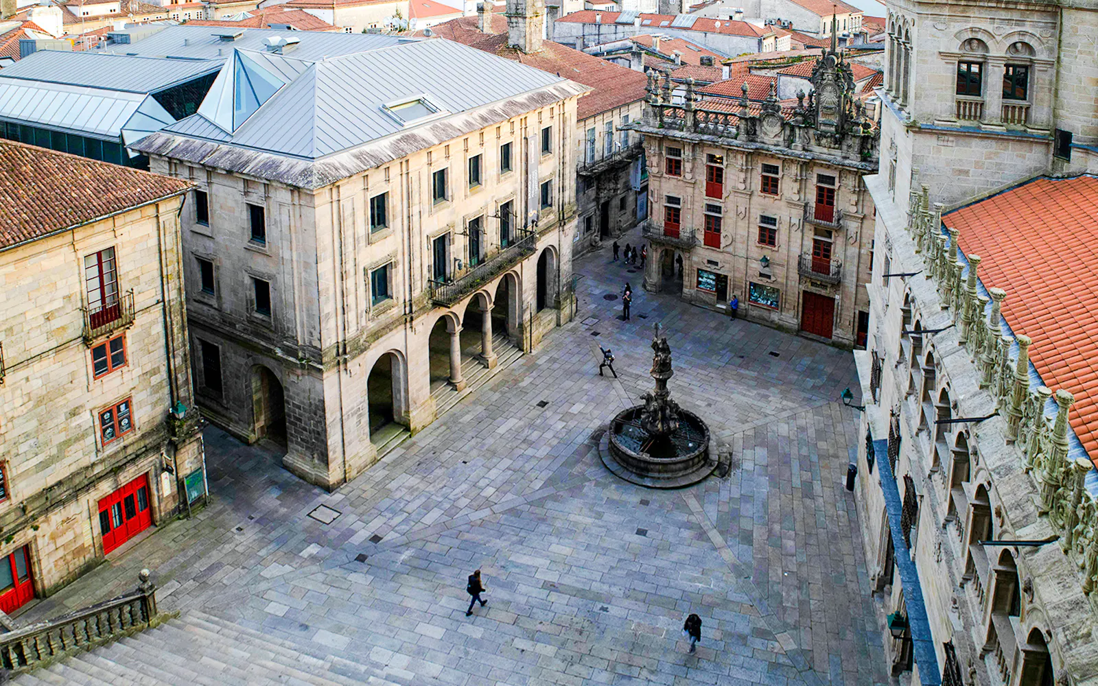 Plaza De Platerias in Santiago Compostela with fountain and historic buildings.