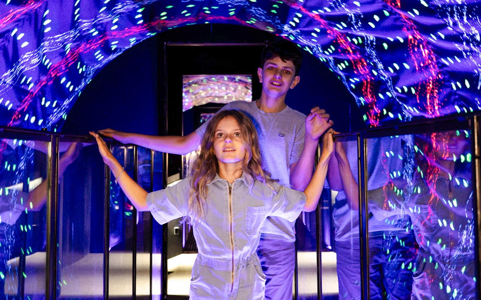 Guests exploring light tunnel at Museum of Illusions Amsterdam.