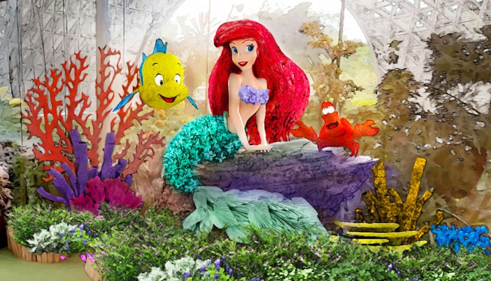 Colorful floral display with mermaid and sea creatures at Gardens by the Bay, Singapore.