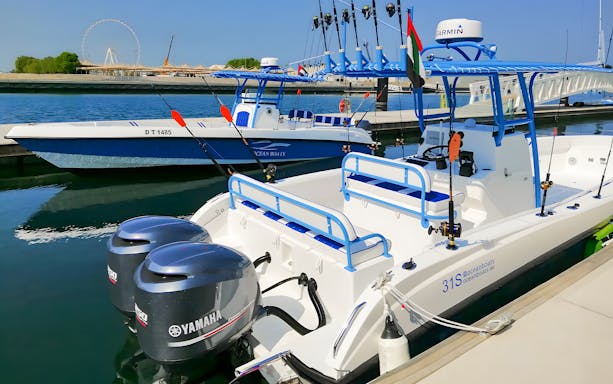 Fishing boats docked at marina for deep sea private fishing charter.