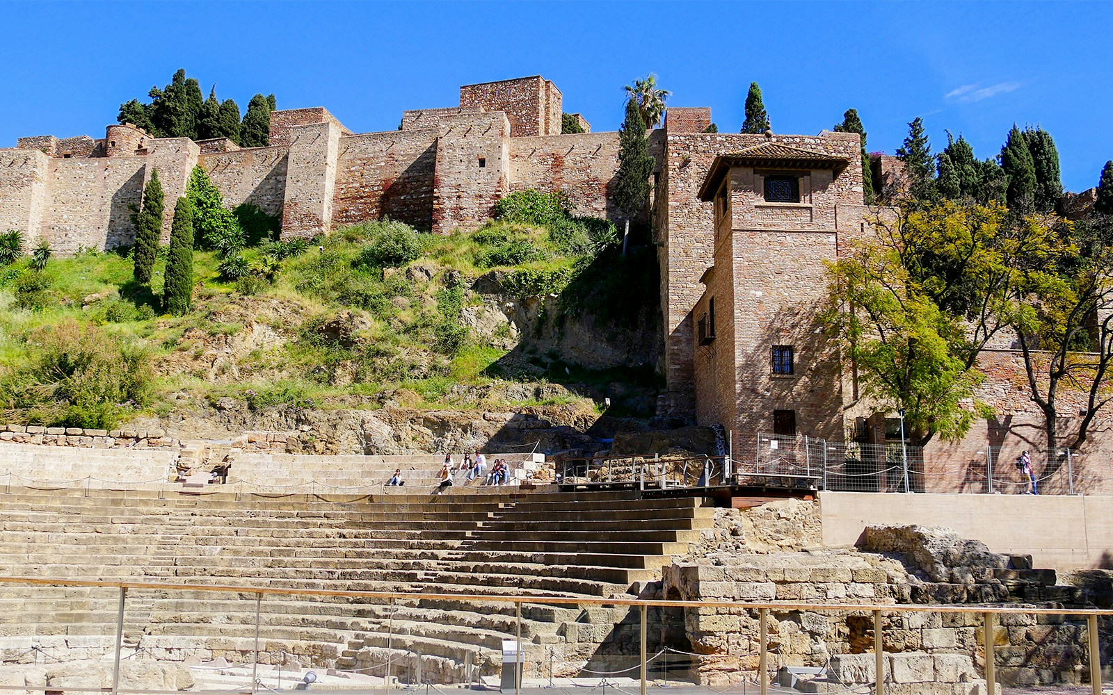 Ancient Roman theater with Alcazaba fortress in the background, Malaga, Spain.