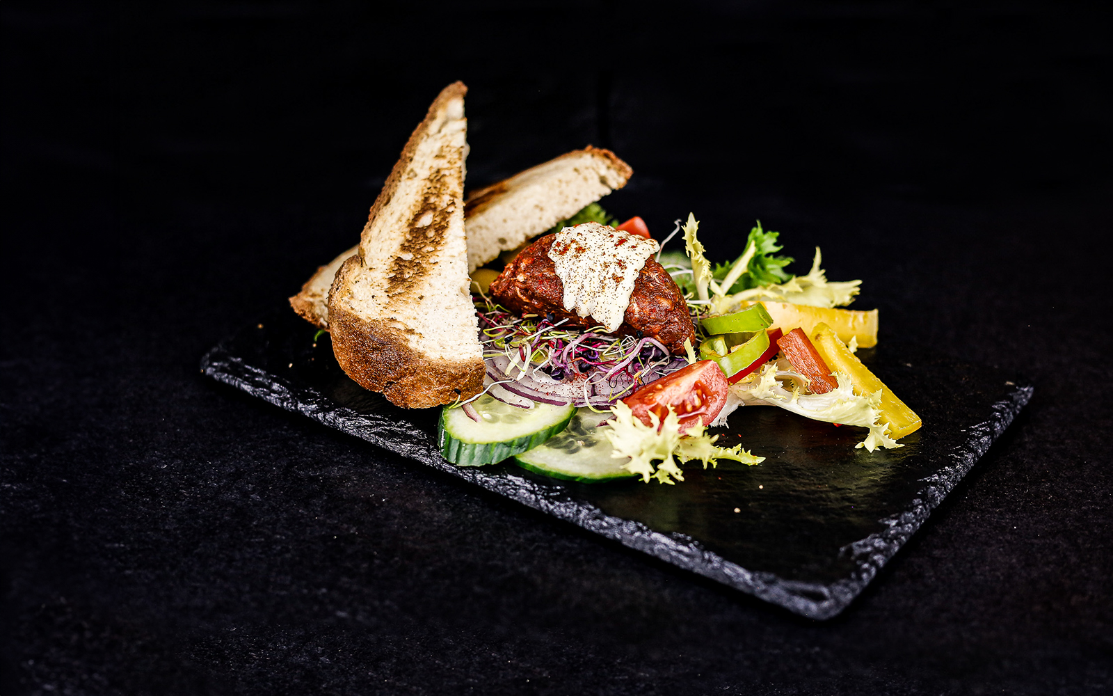 Traditional Hungarian dish with bread and vegetables on a Budapest dinner cruise.
