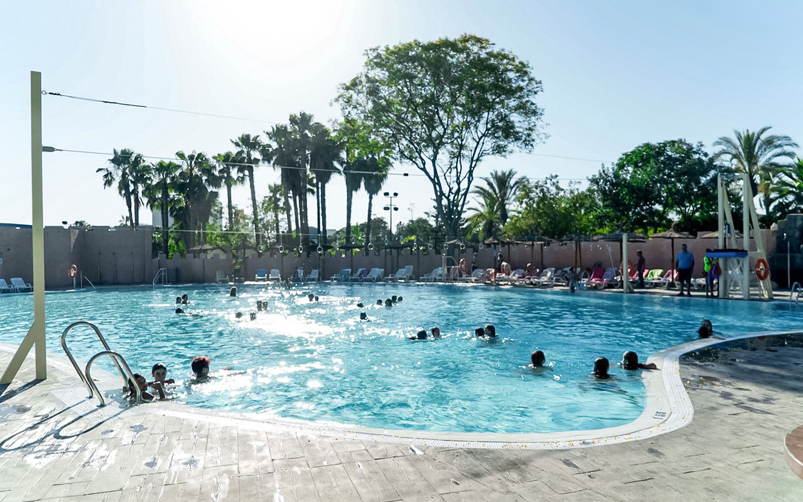 Reef pool at Isla Magica with visitors enjoying water activities in Seville, Spain.