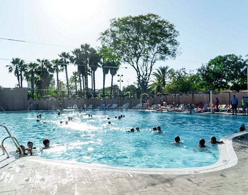 Reef pool at Isla Magica with visitors enjoying water activities in Seville, Spain.