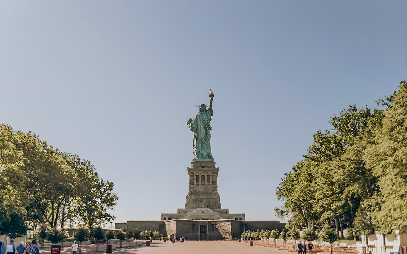 Statue of Liberty with visitors on Liberty Island, New York City.