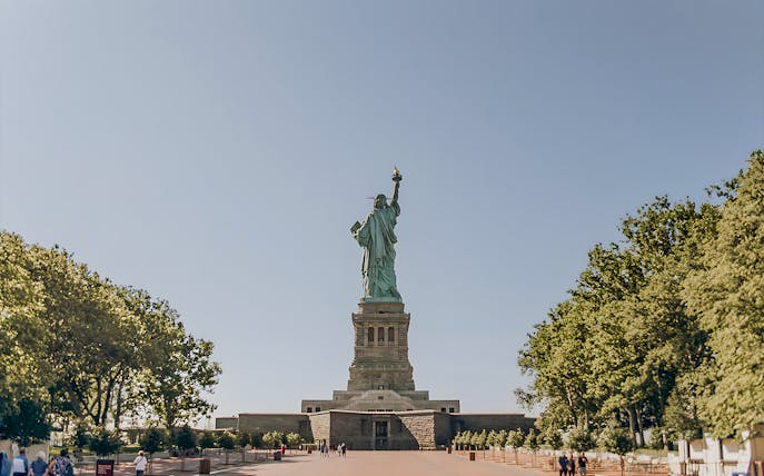 Statue of Liberty with visitors on Liberty Island, New York City.