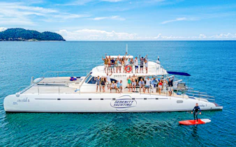 Group enjoying a sailing catamaran tour near Koh Phai, Pattaya.