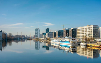 Berlin cityscape with boats on the Spree River during a 2.5-hour highlights cruise.