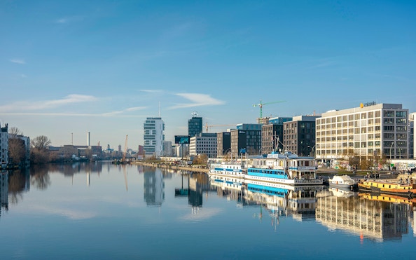 Berlin cityscape with boats on the Spree River during a 2.5-hour highlights cruise.