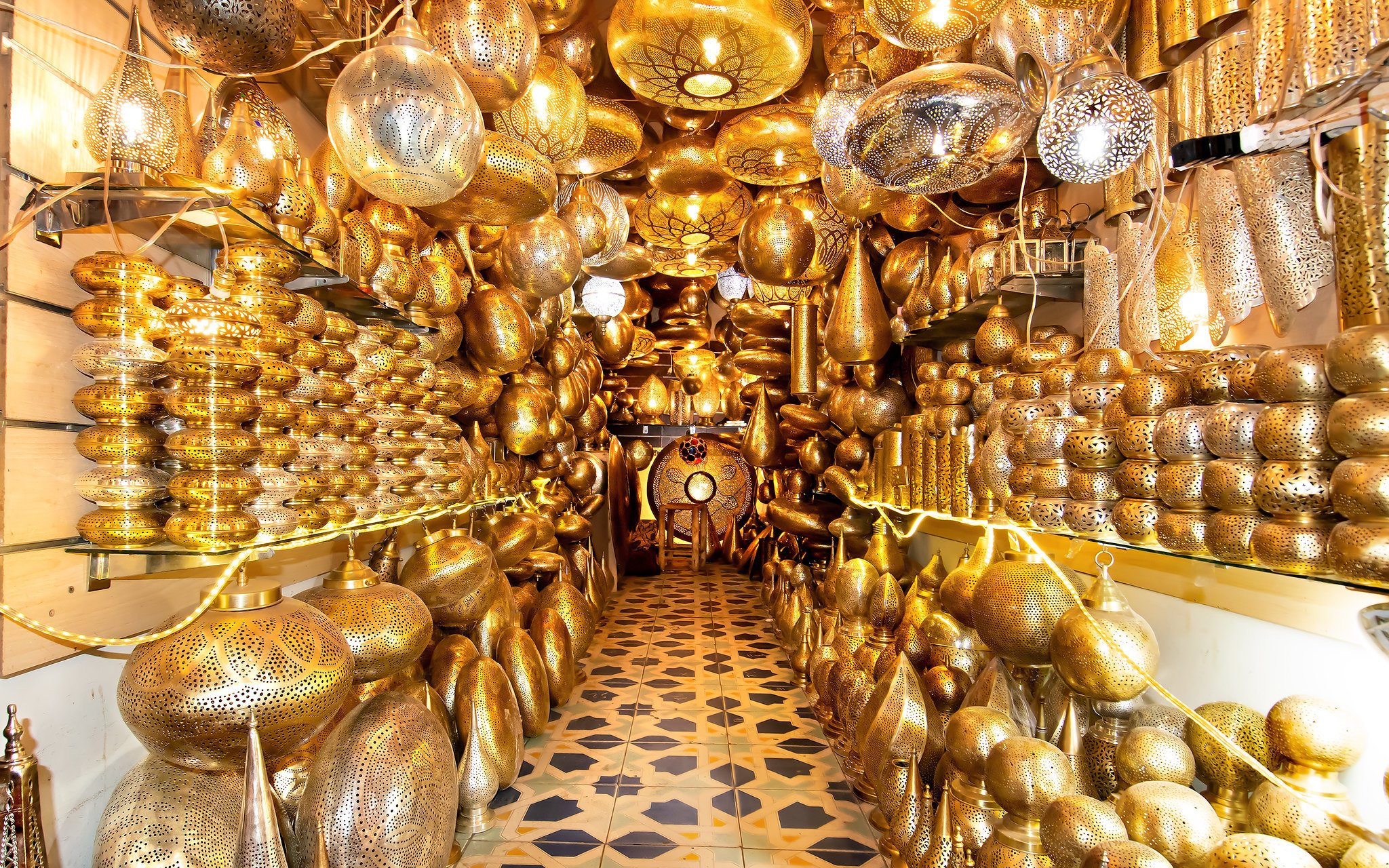 Intricate brass lanterns in a Marrakech souk near Ben Youssef Medersa and Le Jardin Secret.