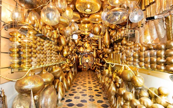 Intricate brass lanterns in a Marrakech souk near Ben Youssef Medersa and Le Jardin Secret.
