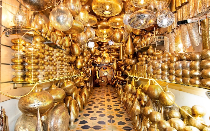 Intricate brass lanterns in a Marrakech souk near Ben Youssef Medersa and Le Jardin Secret.