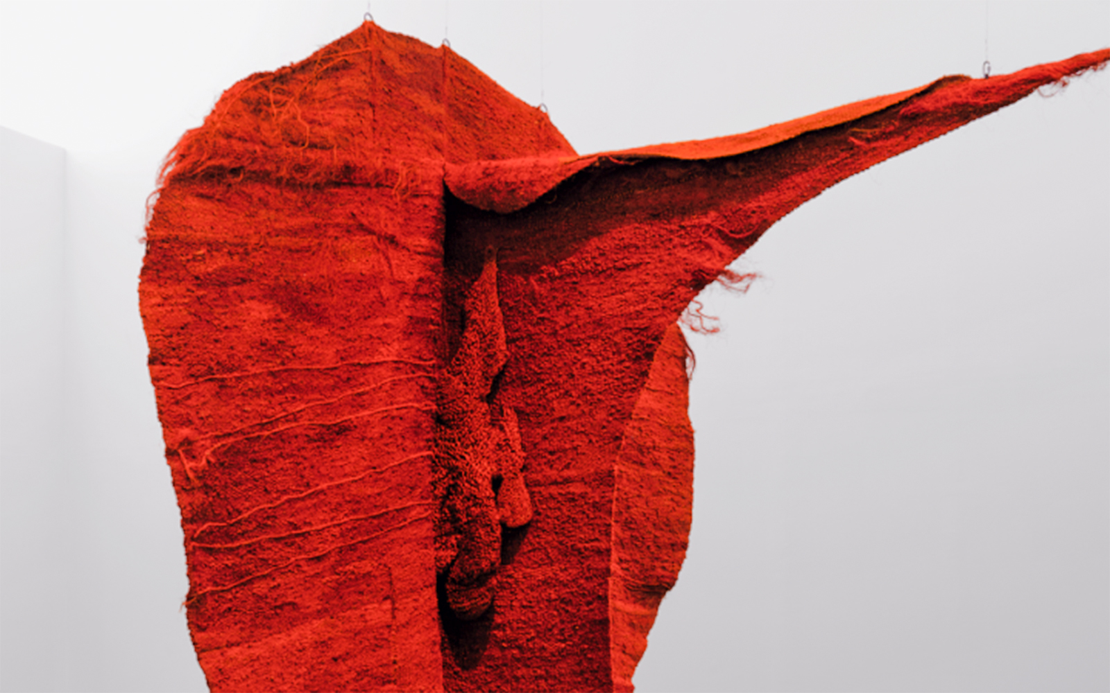 Red textile sculpture "Magadelana the Thread of Existence" at Bourdelle Museum, Paris.
