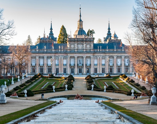 Royal Palace of Madrid designed by Giambattista Sacchetti with ornate architecture and lush gardens.