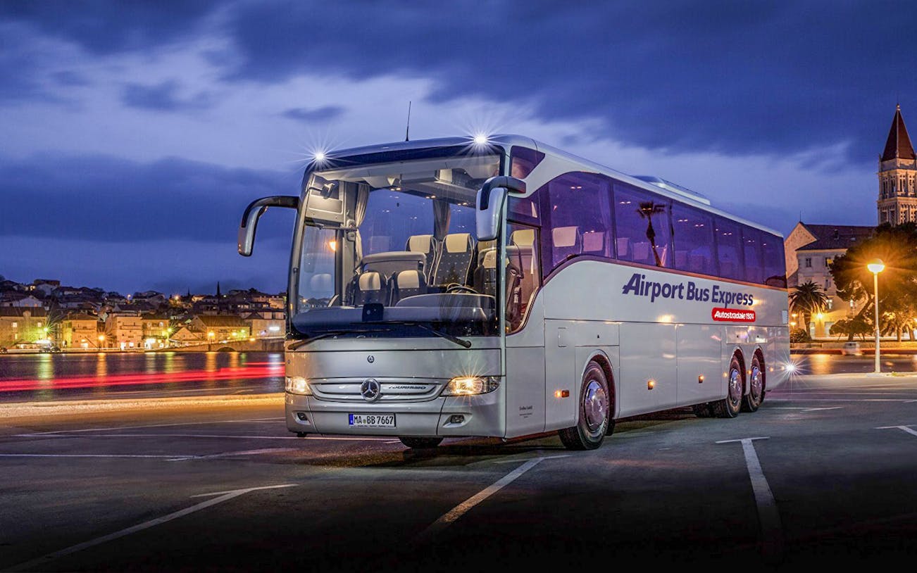 Airport Bus Express parked at night, London Stansted to Stratford route.