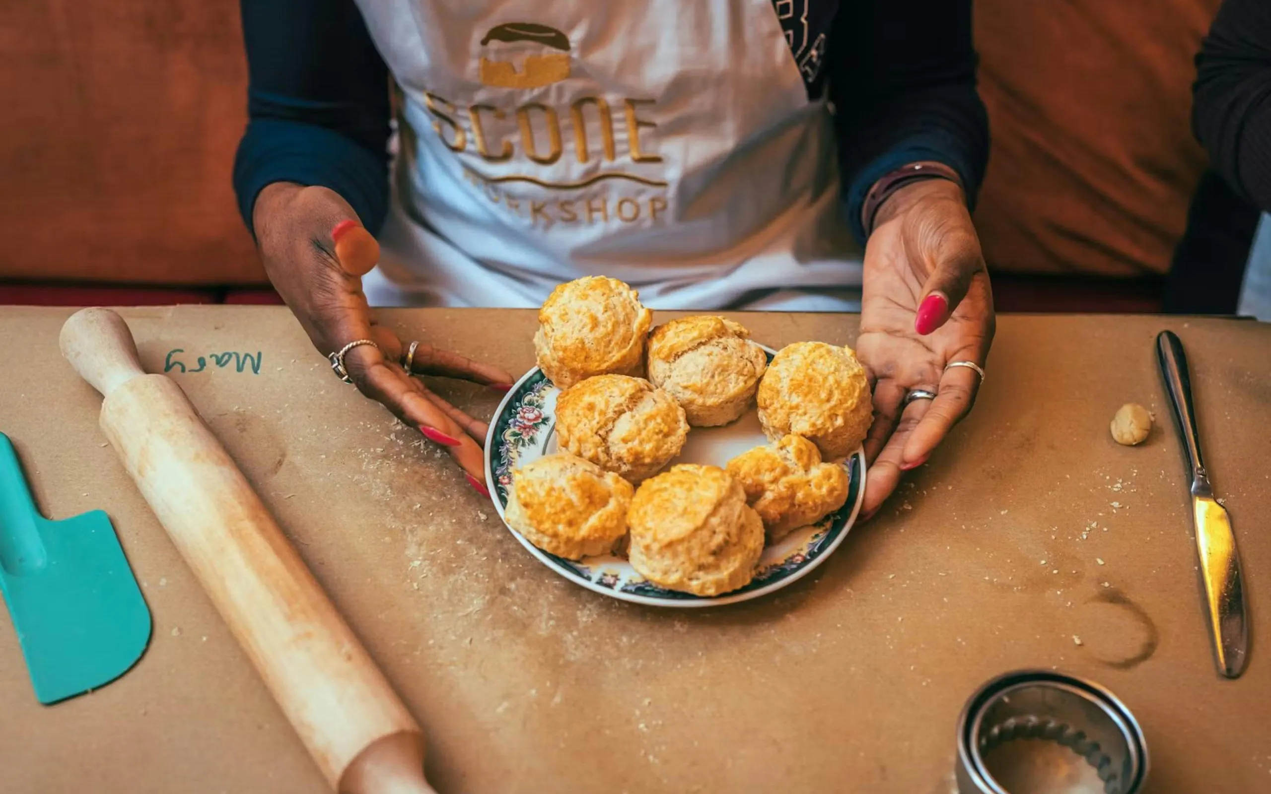 Plate of freshly baked scones at a scone-making workshop in London.