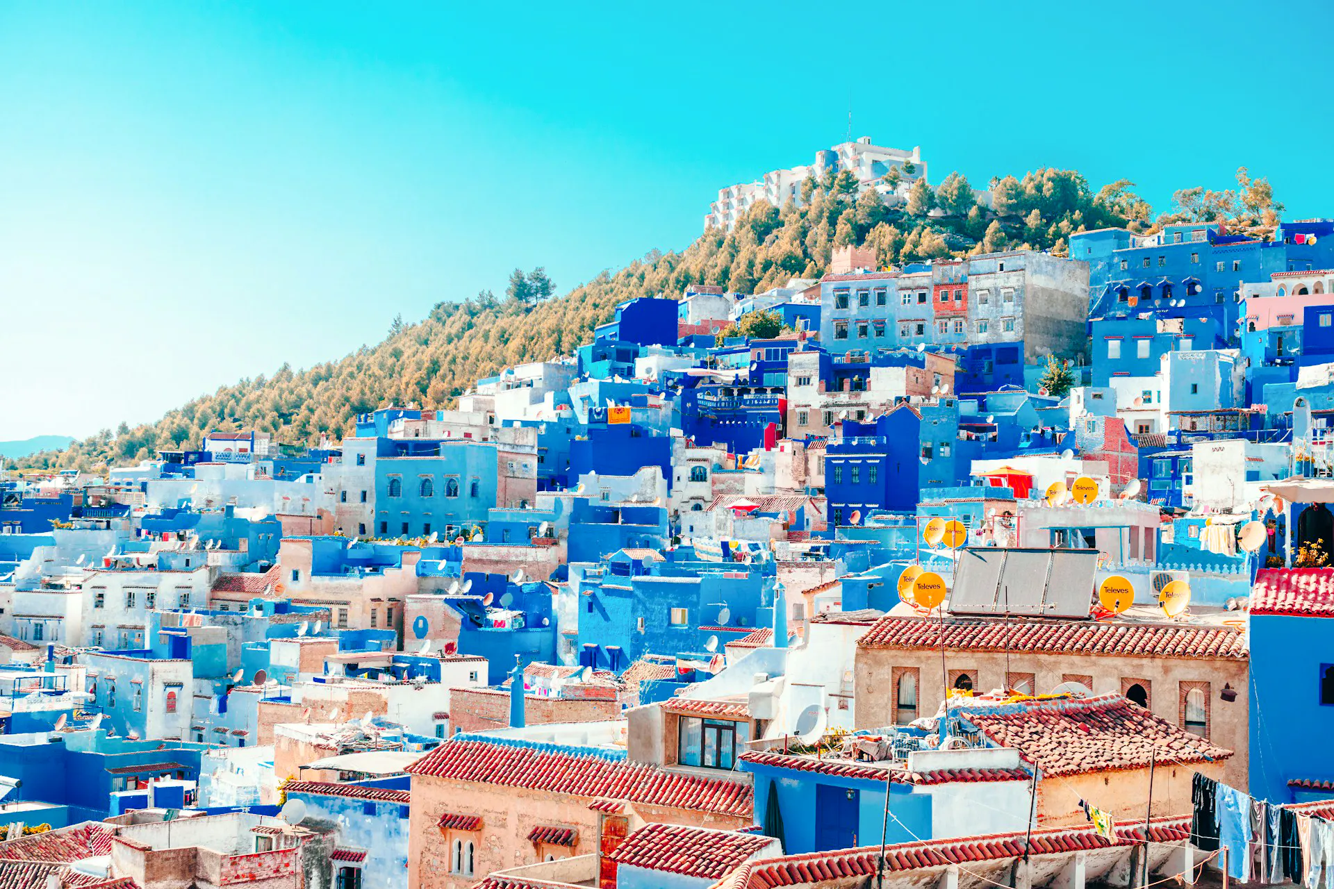 Blue-painted buildings in Chefchaouen, Morocco, part of the 10-Day Morocco Tour from Casablanca.