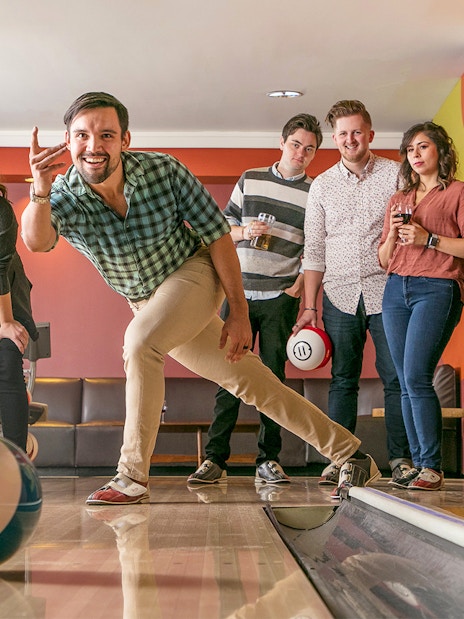 Group enjoying a bowling game in Chicago.