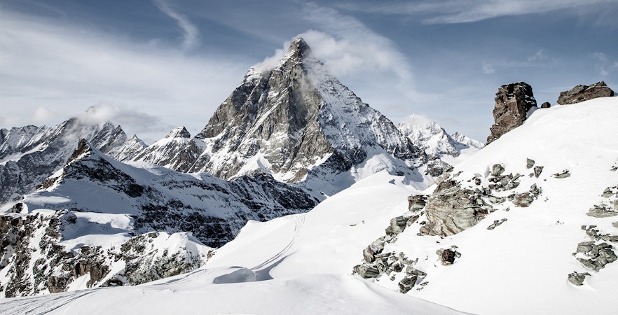 Matterhorn peak viewed from Gornergrat, surrounded by snow-covered Alps.