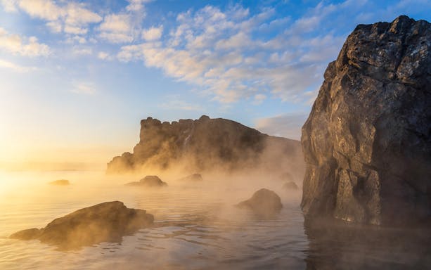 Sky Lagoon with misty rocks and water at sunrise, Saman Pass.