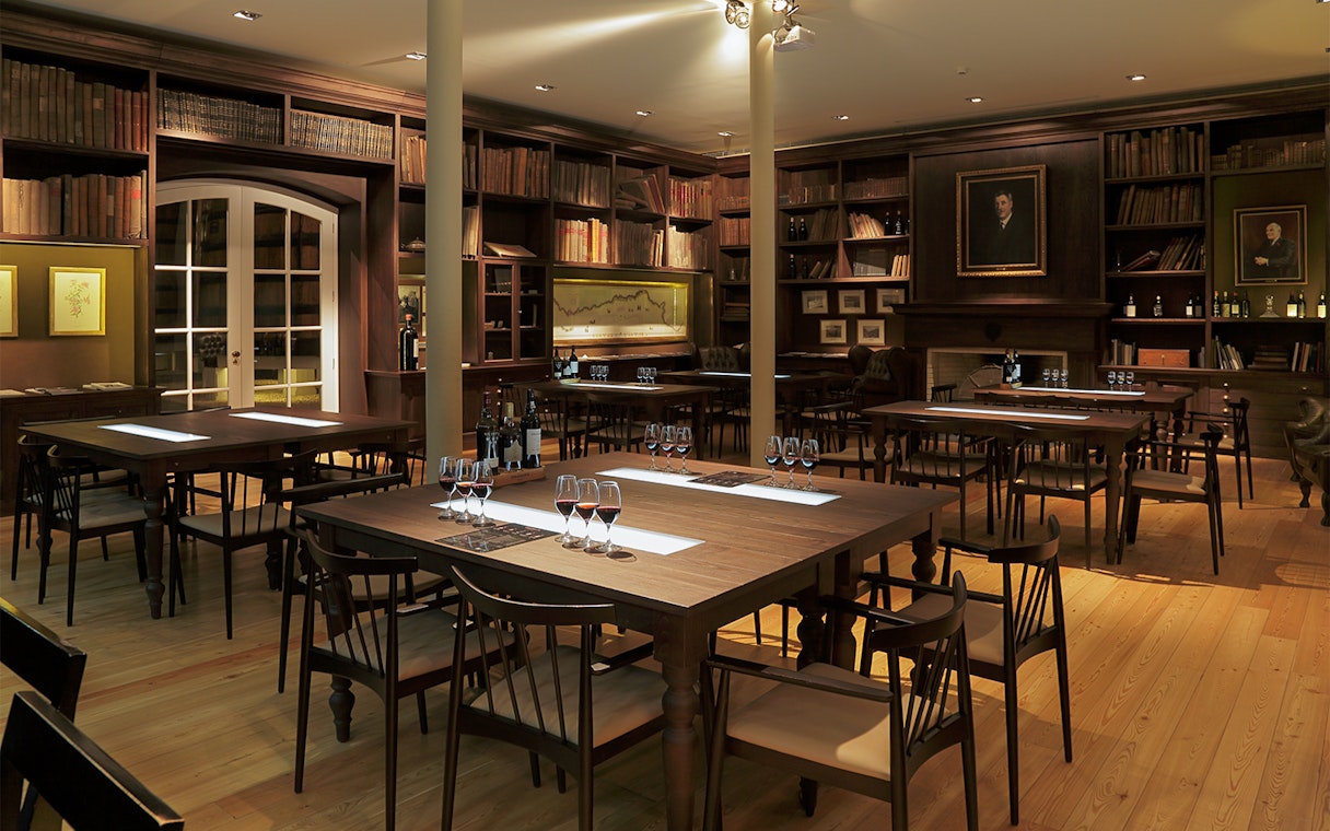 Graham's Port Lodge tasting room with tables set for wine sampling.