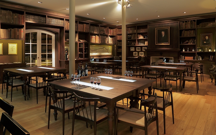 Graham's Port Lodge tasting room with tables set for wine sampling.