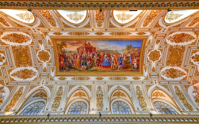 Ceiling fresco and ornate decorations at the Royal Palace of Caserta, Italy.
