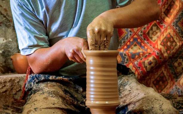 Potter shaping clay on a wheel in Avanos, Cappadocia.