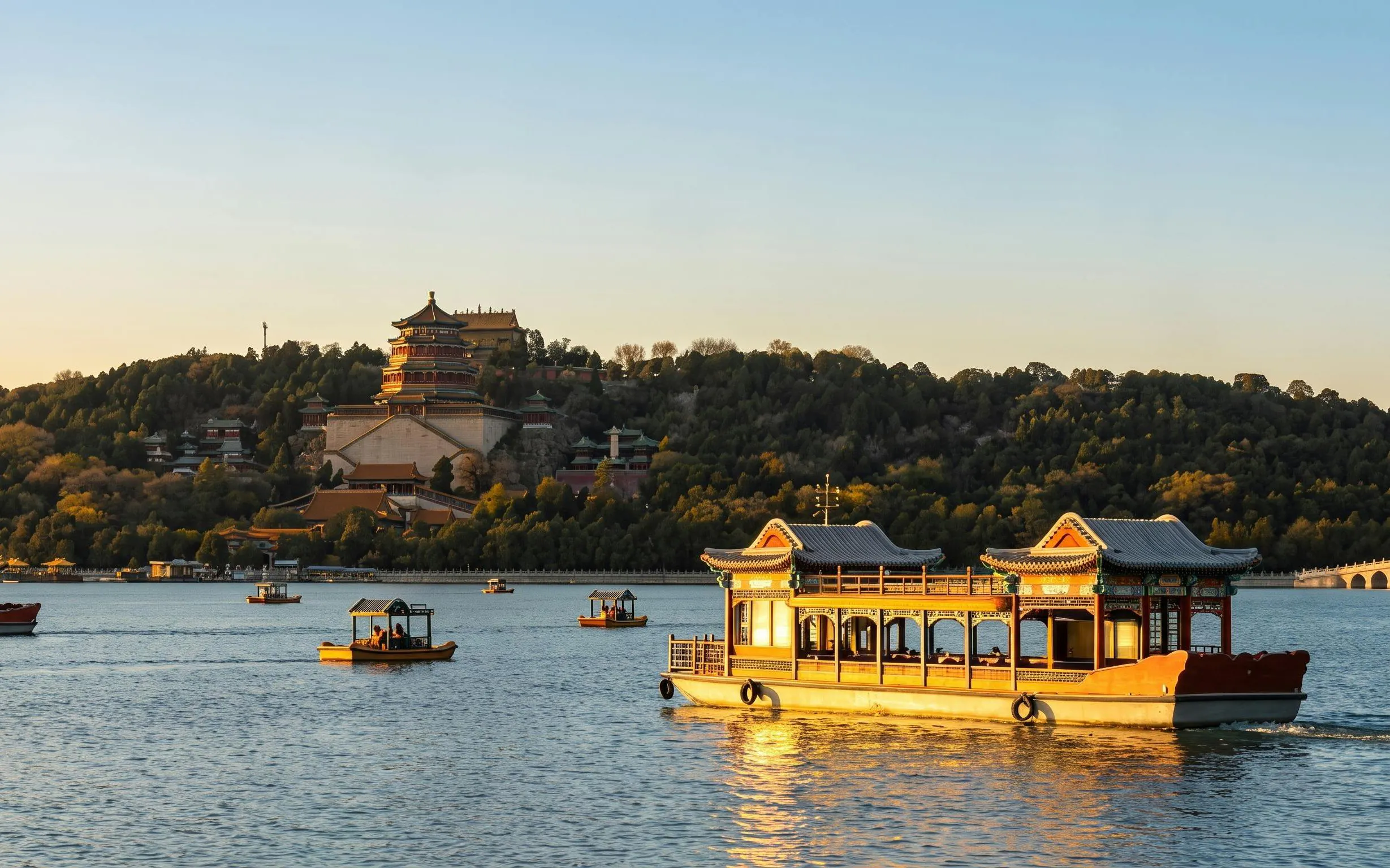 Boats on Kunming Lake with Summer Palace in Beijing during a day tour.