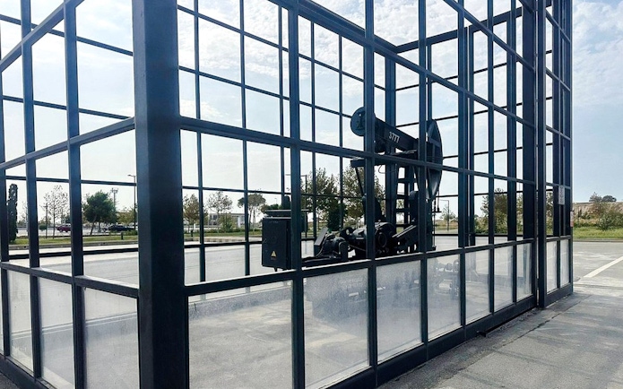 Oil pumpjack enclosed in glass at Gobustan National Park, Azerbaijan.