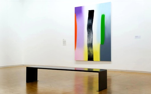 Art installation with colorful abstract painting and bench at Centre Pompidou, Paris.