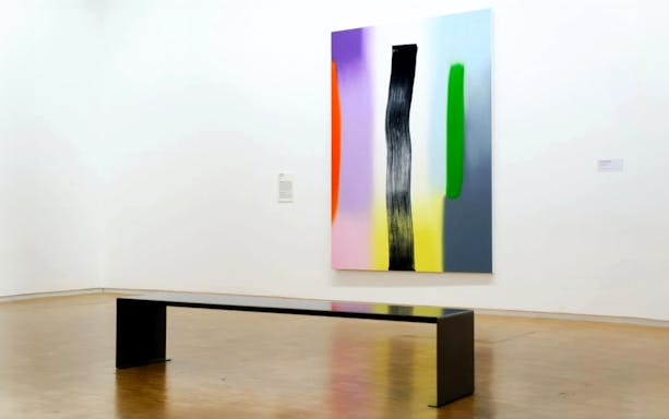 Art installation with colorful abstract painting and bench at Centre Pompidou, Paris.