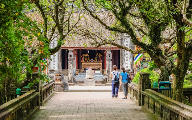 Entrance to Hoa Lư Ancient Capital with visitors in Ninh Bình, Vietnam.